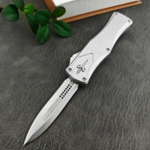 zinkhandtag Microtech Hera Goddess vitt handtag dubbeleggad OTF-kniv
